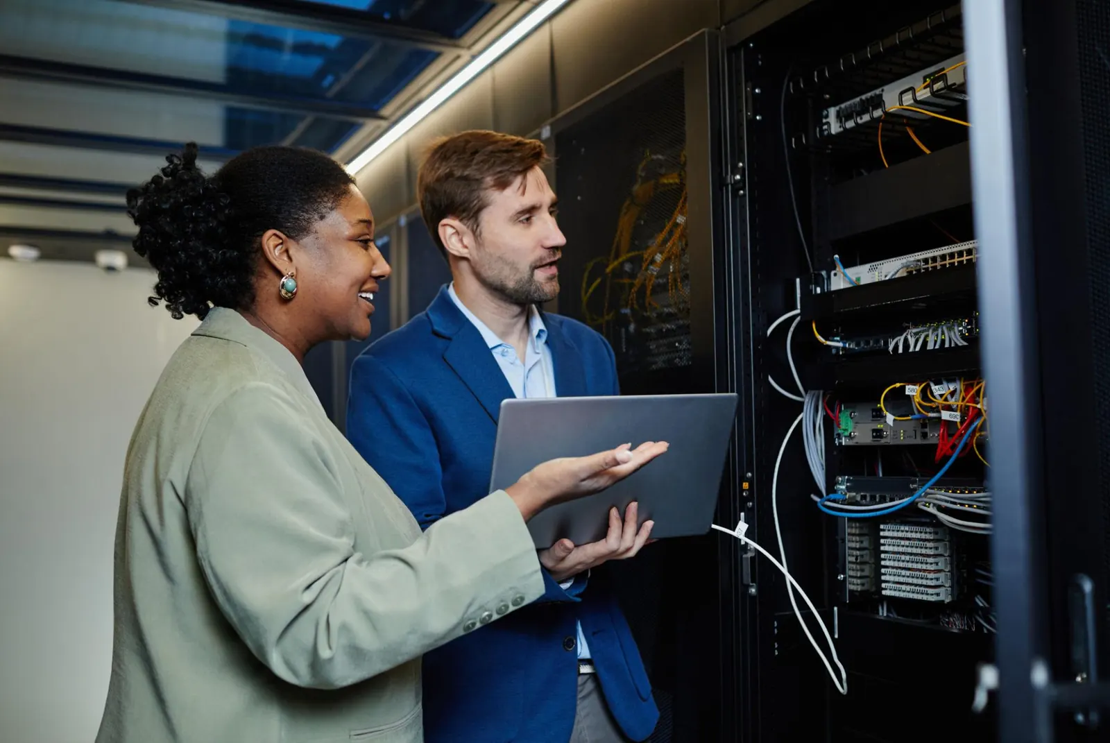 Jantec engineers reviewing a network rack